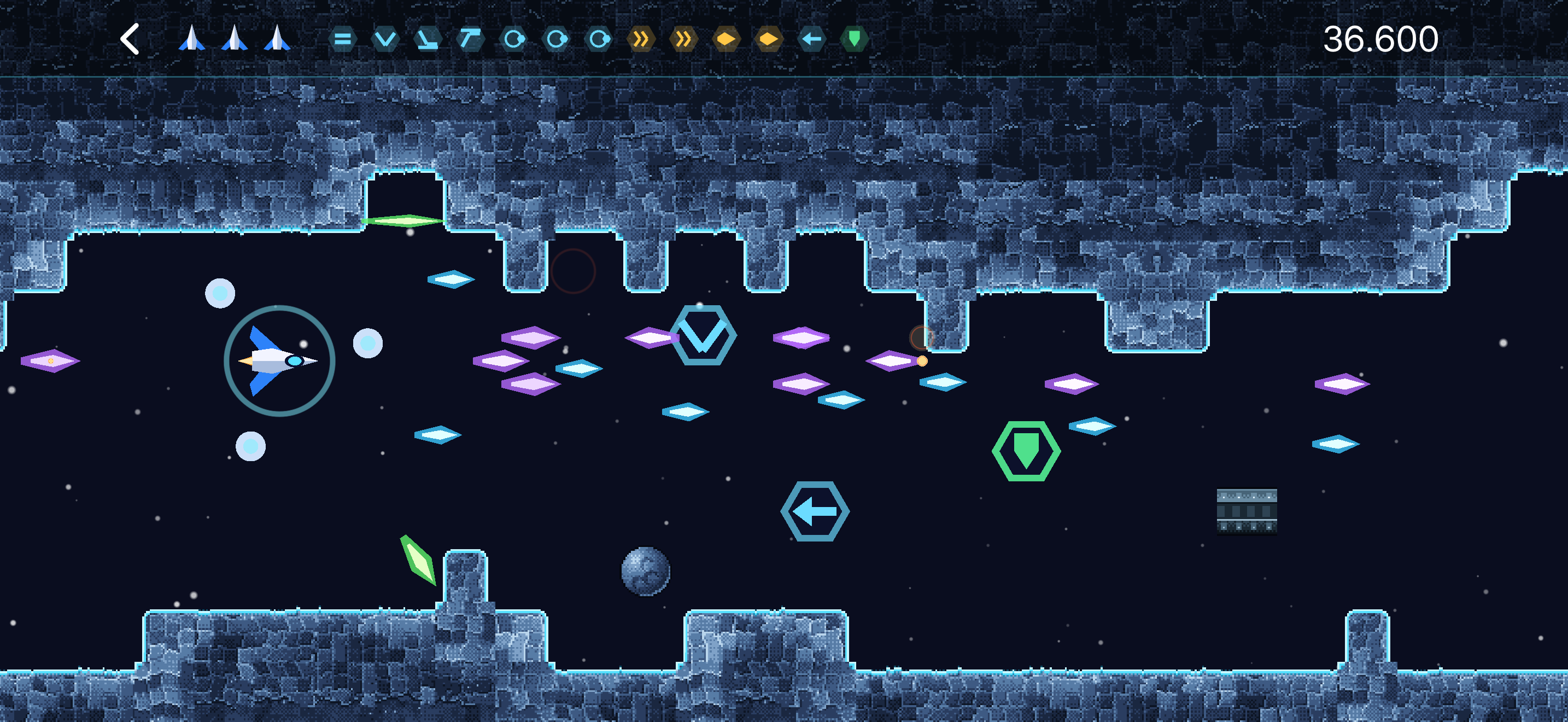 The fighter deep inside a canyon, the ceiling stepping down towards it, with pods and a swarm of enemies filling the corridor ahead